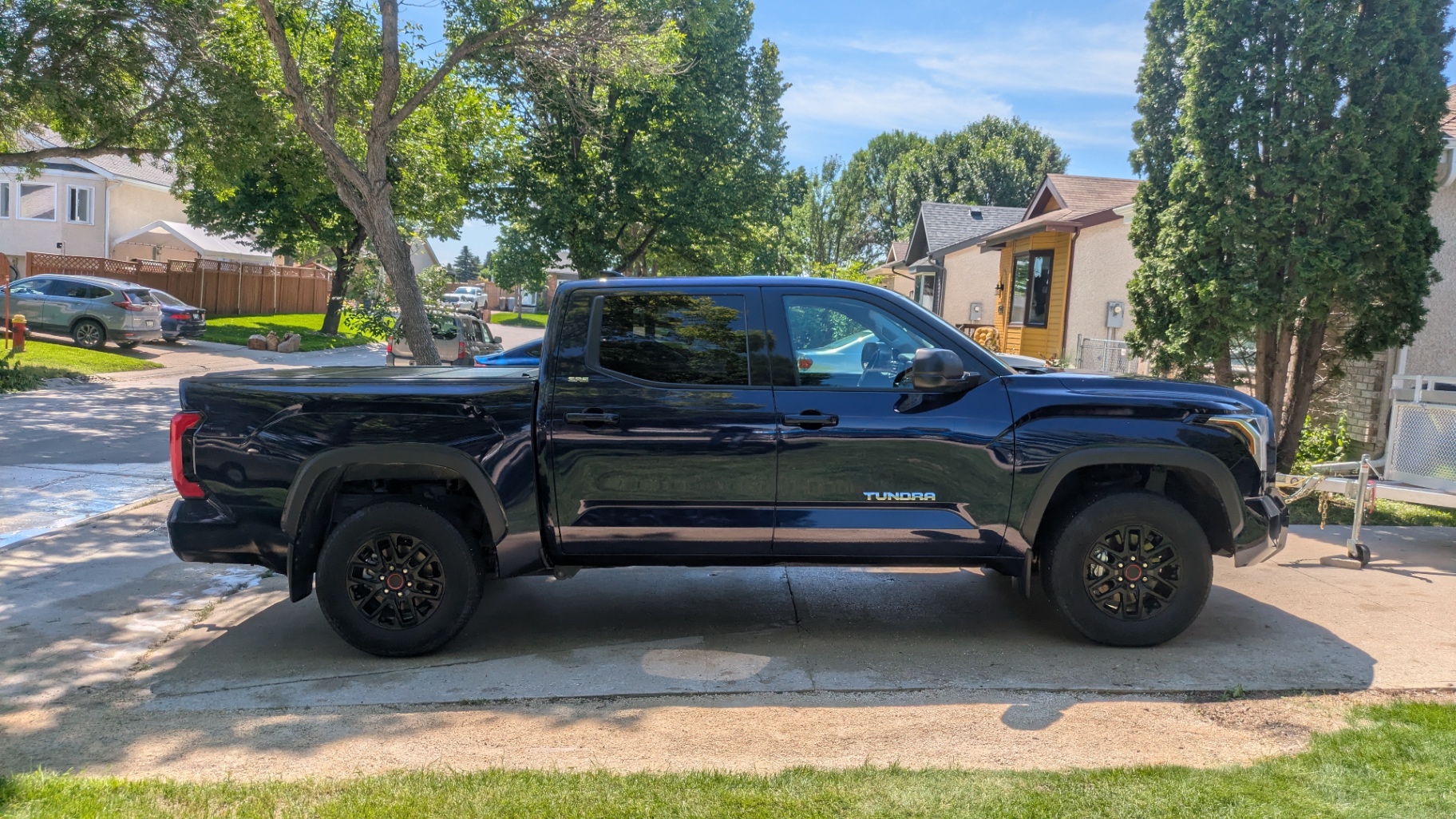 Toyota Tundra, deep-blue paint mirroring the sky