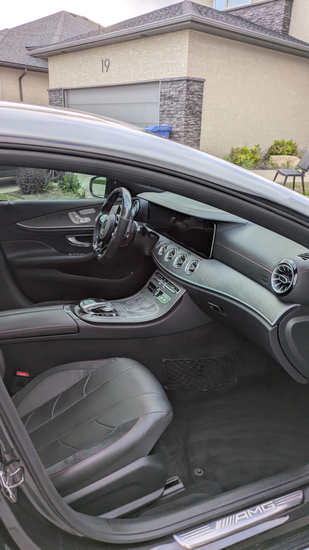 CLS 53 passenger side, red-stitched leather spotless